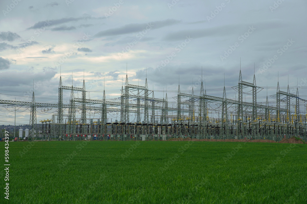 Power lines and substation, extra high voltage lines behind the