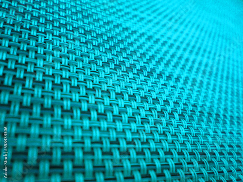 Abstract macro shot of an electric blue woven net 