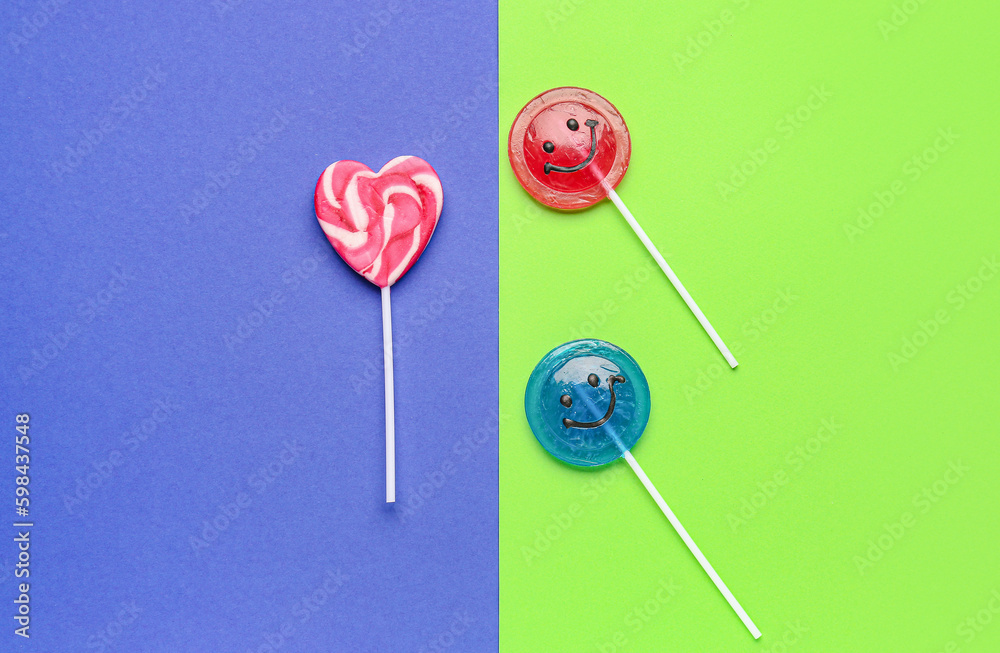 Sweet lollipops on blue and green background Sweet lollipops on blue and green background