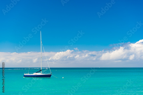 summer vacation yacht at seascape, advertisement. summer vacation yacht at seaside. photo of summer vacation yacht on the beach. summer vacation yacht