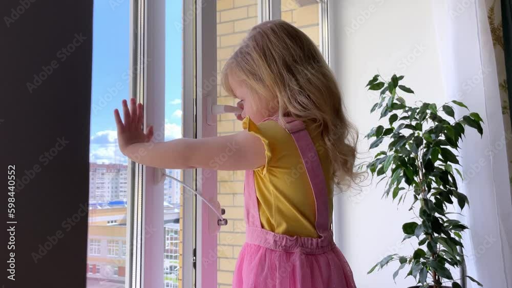 safety at home for small children. a lock on the window protects ...