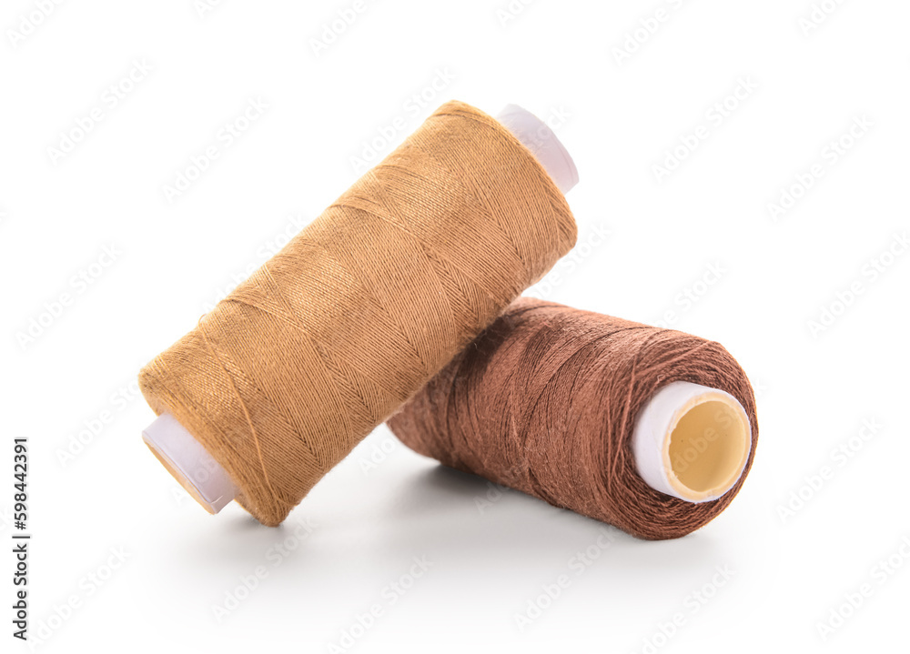 Two thread spools isolated on white background Two thread spools isolated on white background