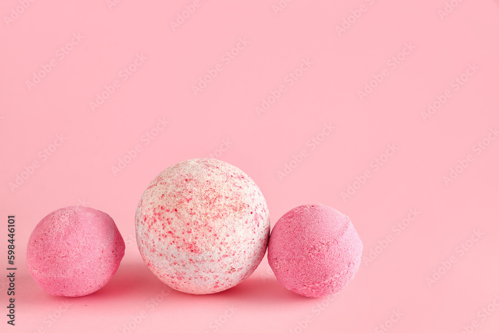 Bath bombs on pink background