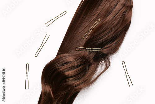 Brown hair strand with gold...