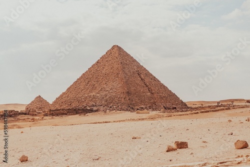 Majestic Pyramids of Egypt rise proudly against the vast desert landscape  a timeless testament to ancient civilization s architectural brilliance