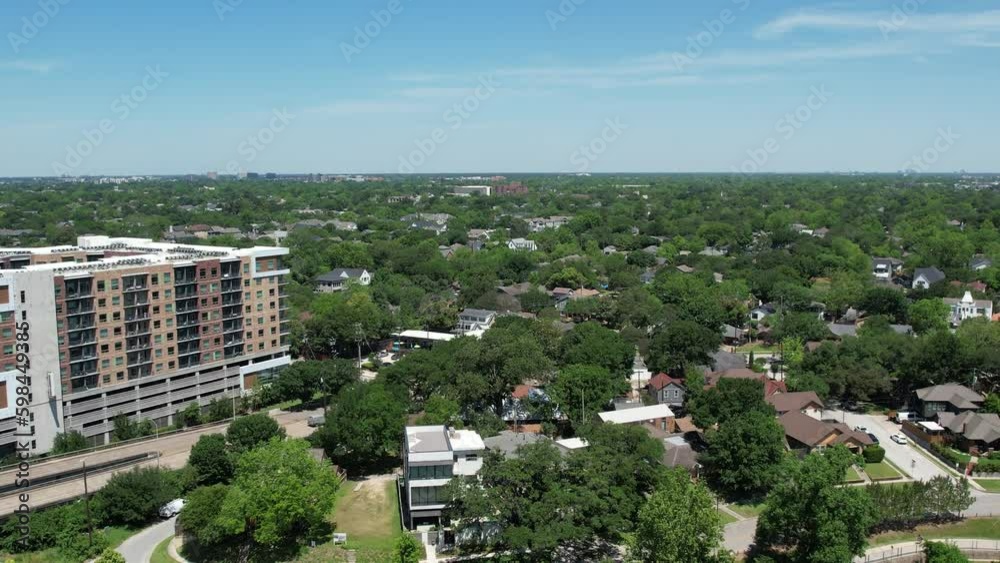 Discover the charm and character of Houston Heights from above with this stunning aerial footage. Watch as the drone moves slowly over the vibrant neighborhood, capturing its unique architecture, gree Discover the charm and character of Houston Heights from above with this stunning aerial footage. Watch as the drone moves slowly over the vibrant neighborhood, capturing its unique architecture, gree