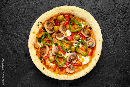 Vegetable pizza on dark background