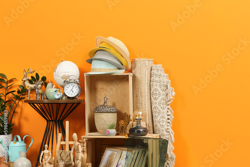 Photos Many different items near orange wall. Garage sale