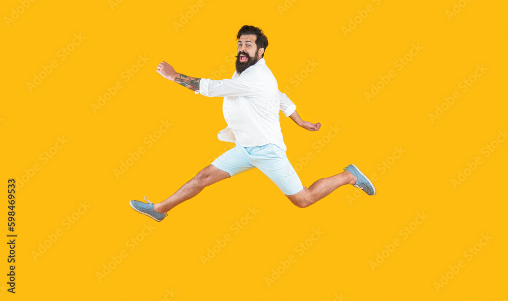 hurrying man isolated on yellow. hurrying man in studio. hurrying man on background.