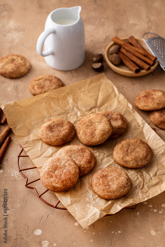 Cinnamon cookies on a parchment paper with milk Cinnamon cookies on a parchment paper with milk