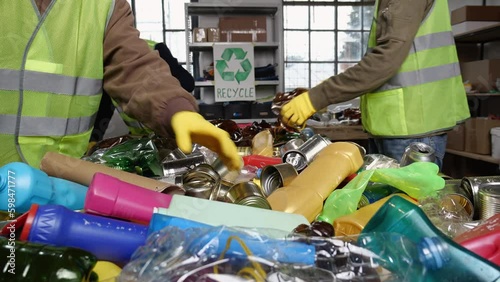 Glass, aluminum foil, paper, and plastic containers recycle. Waste sorting and recycling workers. Commingled recycling materials onto a conveyor belt Generative AI