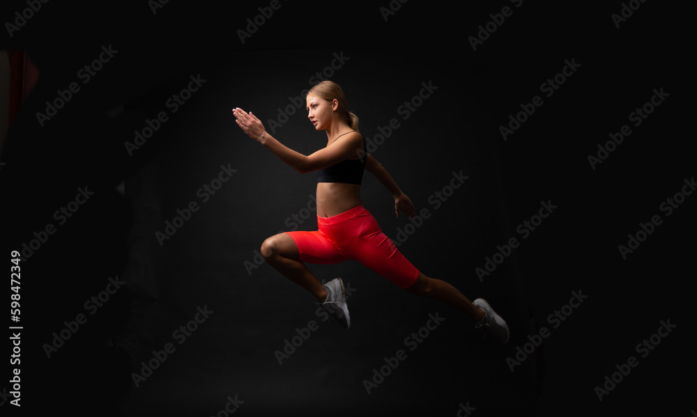 woman sport runner isolated on black. woman sport runner in studio.