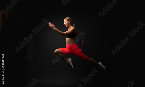 woman sport runner isolated on black. woman sport runner in studio.