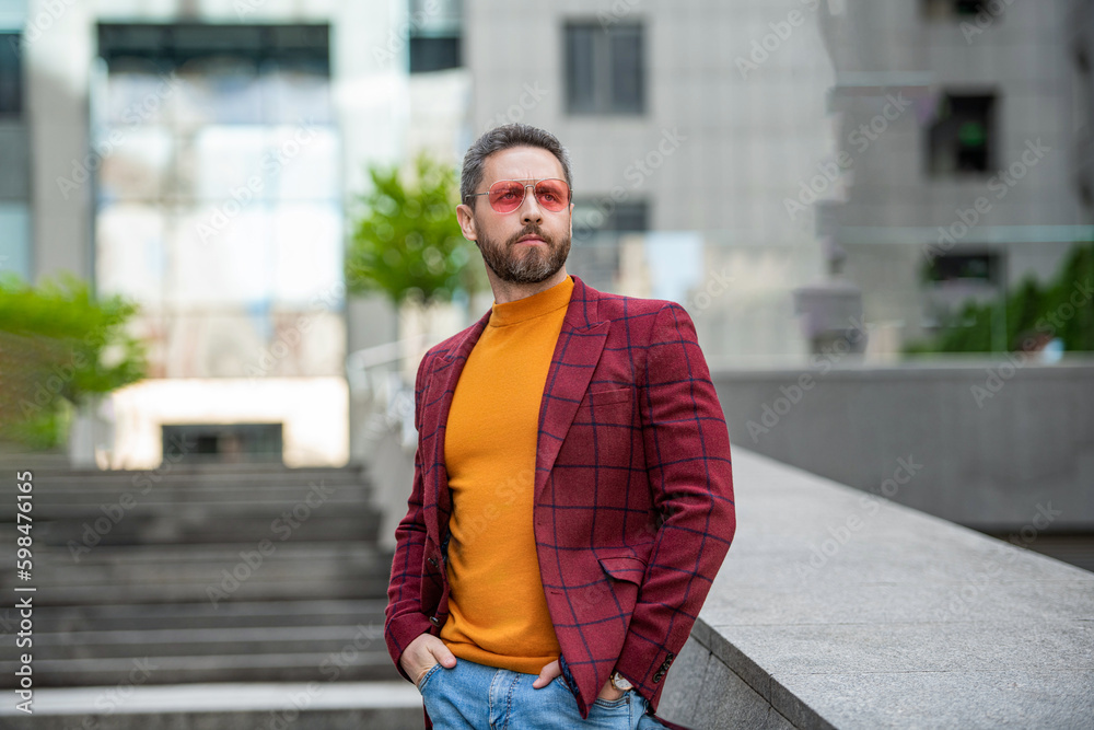 photo of man in menswear of jacket and glasses. man in menswear outdoor. photo of man in menswear of jacket and glasses. man in menswear outdoor.