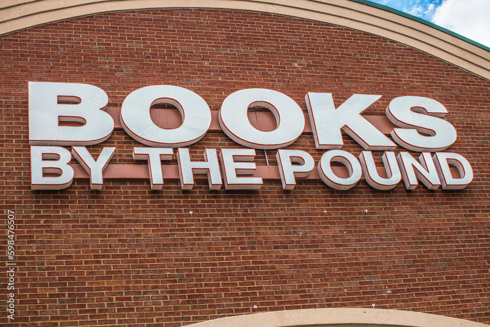 Books by the pound retail book store wall sign Stock Photo Adobe Stock