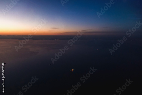 Canvas Print View from the plane to the Arabian Sea and Dubai in the background