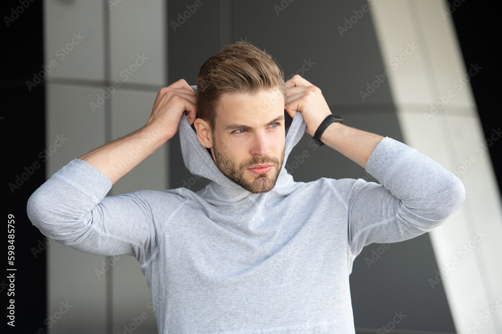 photo of fitness man wearing hoodie. fitness man in hoodie. fitness man in hoodie outdoor. photo of fitness man wearing hoodie. fitness man in hoodie. fitness man in hoodie outdoor.
