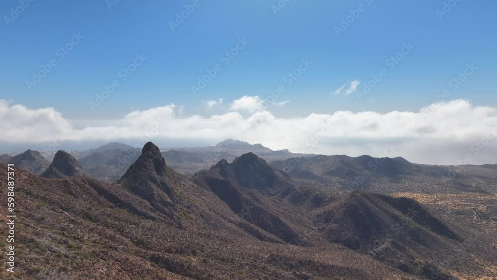 Video with aerial view on a mountain with a cloudy sky Video with aerial view on a mountain with a cloudy sky
