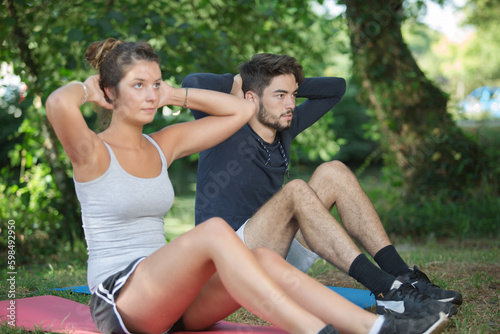Man and woman exercising outdoors