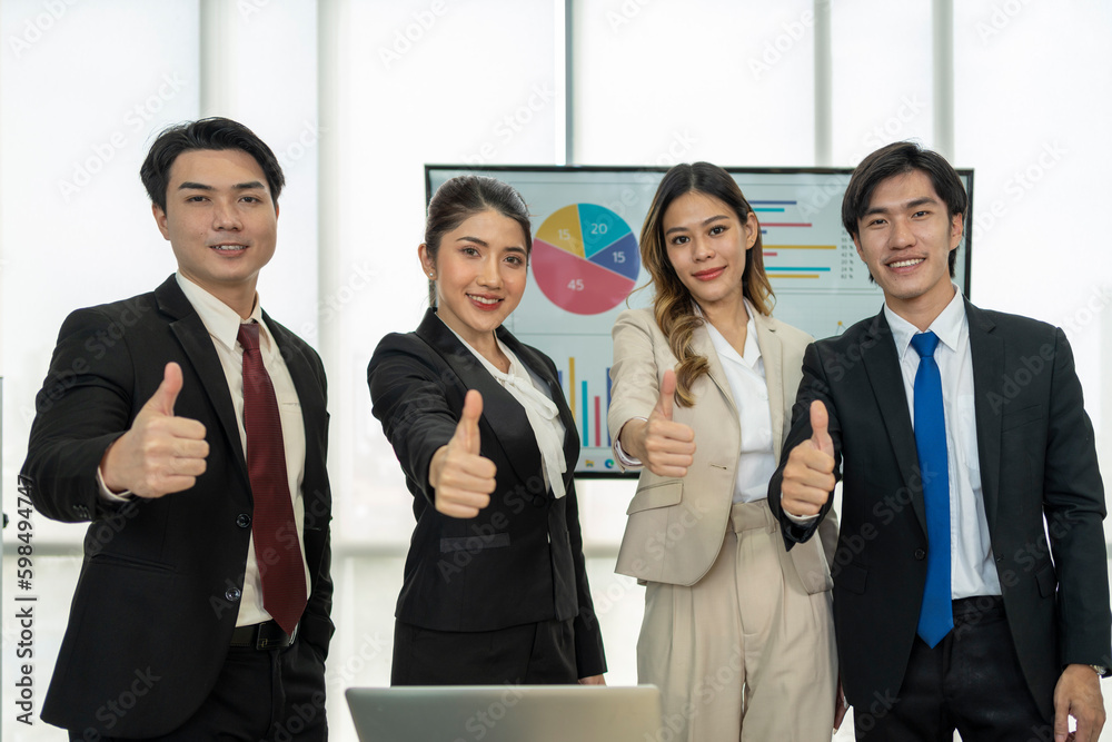 Group of successful business people showing thumbs up Group of successful business people showing thumbs up