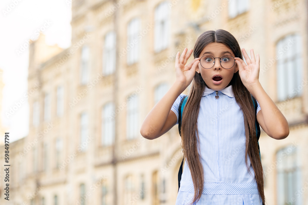 Fototapeta premium eyesight of amazed school girl with glasses. eyesight of school girl outdoor.
