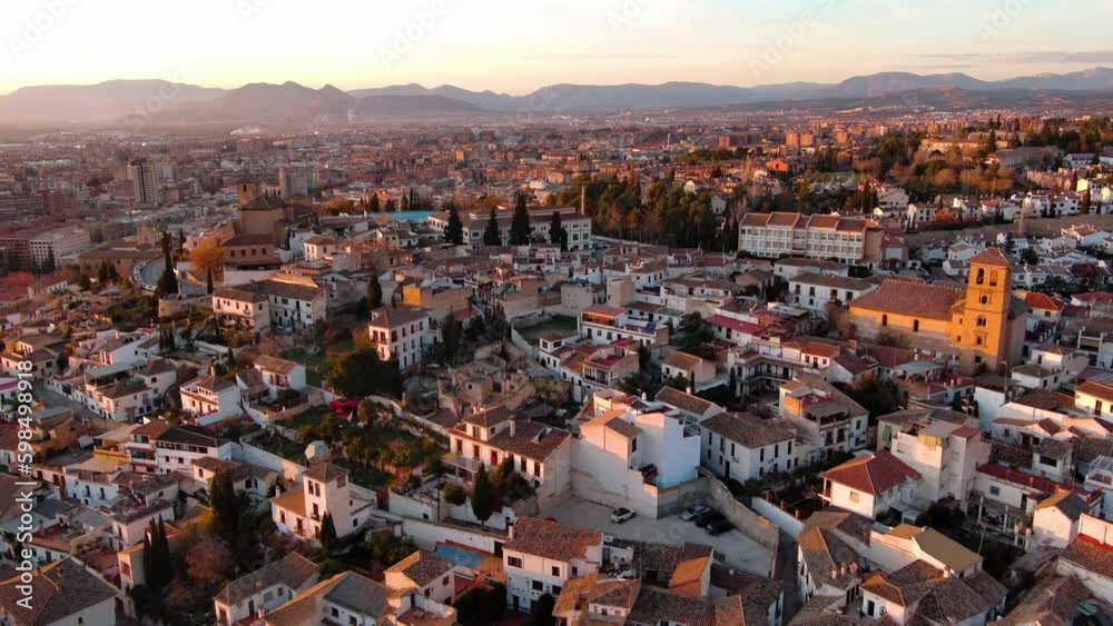 Aerial view of Granada city, Albaicin district at sunset, old Moorish quarter of the city, located on a hill facing the Alhambra. Andalusia, Spain Aerial view of Granada city, Albaicin district at sunset, old Moorish quarter of the city, located on a hill facing the Alhambra. Andalusia, Spain