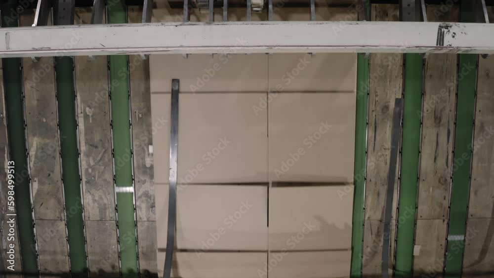Folded cardboard boxes transported by automatic production line upper view. Conveyor belt carries carton paper items at manufacturing plant Generative AI Folded cardboard boxes transported by automatic production line upper view. Conveyor belt carries carton paper items at manufacturing plant Generative AI