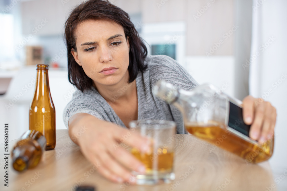 lonely and thirsty woman having a problem with alcohol lonely and thirsty woman having a problem with alcohol