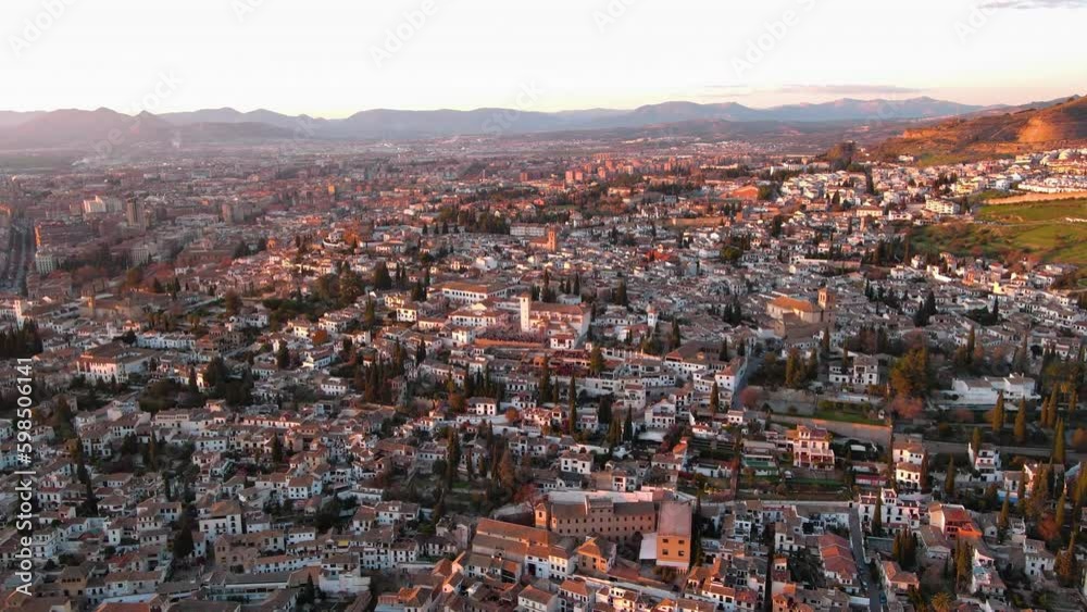 Aerial view of Granada city, Albaicin district at sunset, old Moorish quarter of the city, located on a hill facing the Alhambra. Andalusia, Spain Aerial view of Granada city, Albaicin district at sunset, old Moorish quarter of the city, located on a hill facing the Alhambra. Andalusia, Spain