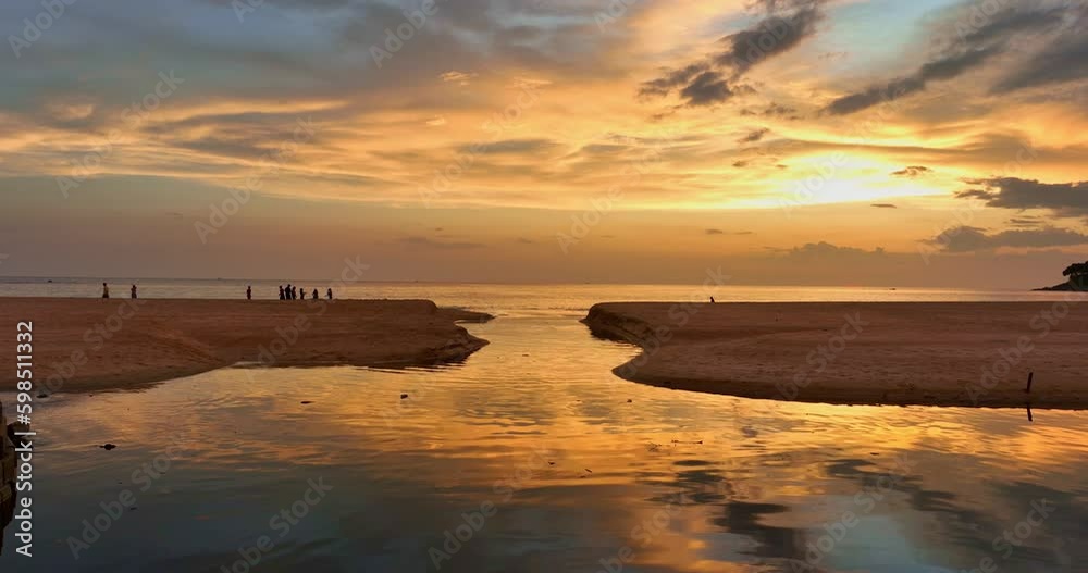 .aerial view stunning reflection of bright golden sky in a canal at Karon beach Phuket..Imagine a fantasy colorful clouds changing in sky of sunset..Gradient color. Sky texture, .aerial view stunning reflection of bright golden sky in a canal at Karon beach Phuket..Imagine a fantasy colorful clouds changing in sky of sunset..Gradient color. Sky texture,