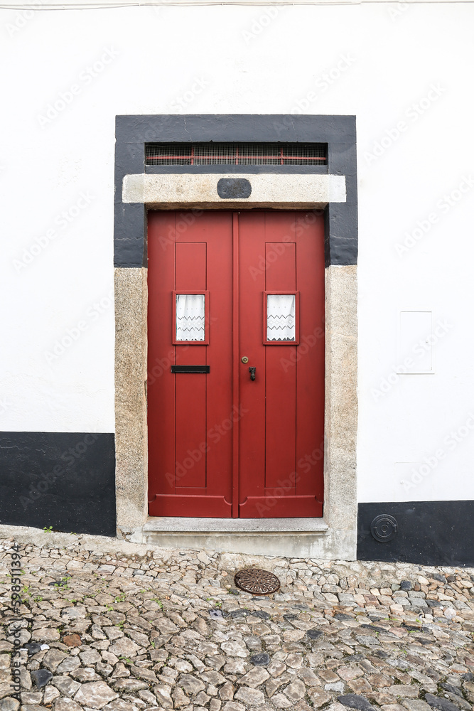 Typical Portuguese facade with colorful red door
