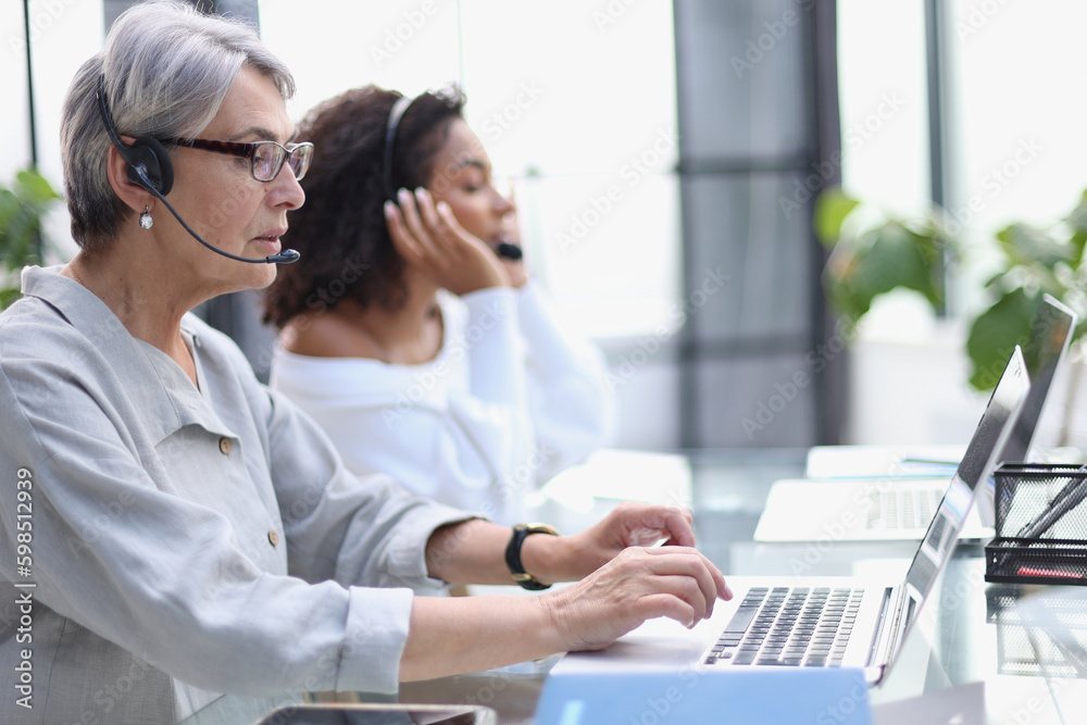 businesswoman working with a headset and accompanied.