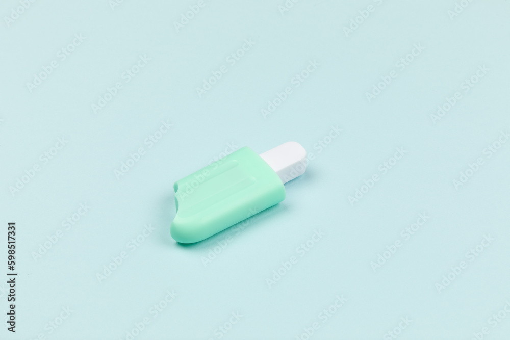 closeup of a popsicle on cyan surface icecream closeup of a popsicle on cyan surface icecream