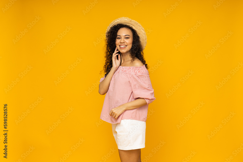 Young woman in casual summer wearing on yellow background Young woman in casual summer wearing on yellow background