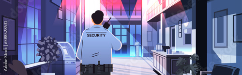 male security guard in uniform using walkie-talkie in night office public or private safety concept