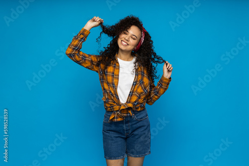 Young woman in casual wearing on blue background