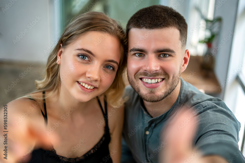 A young couple showing love and embracing happily A young couple showing love and embracing happily