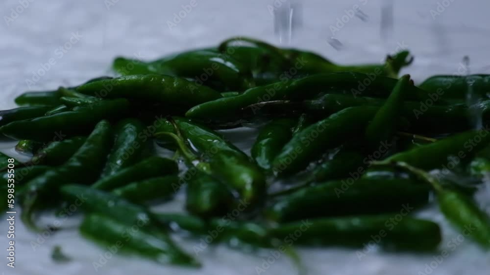 green pepper falling water drops with a splash. green pepper falling water drops with a splash.