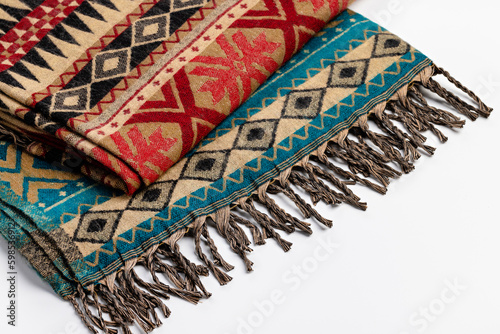 Scarf, stole with ornament and fringe on a white background. Indian drawing, close-up.
