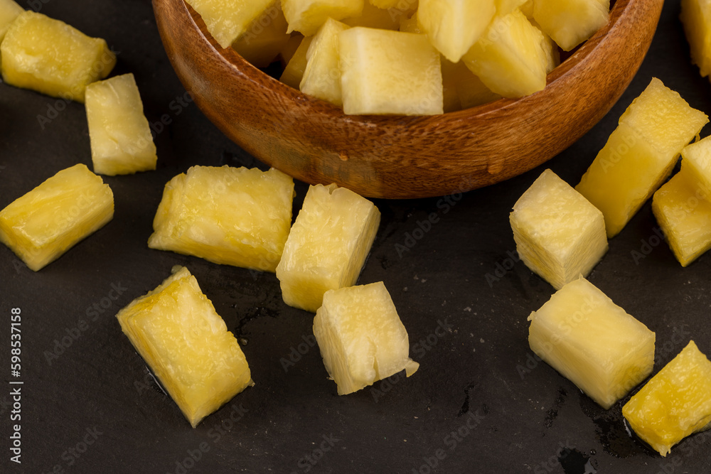 sliced ripe yellow pineapple, a large number of pieces sliced ripe yellow pineapple, a large number of pieces