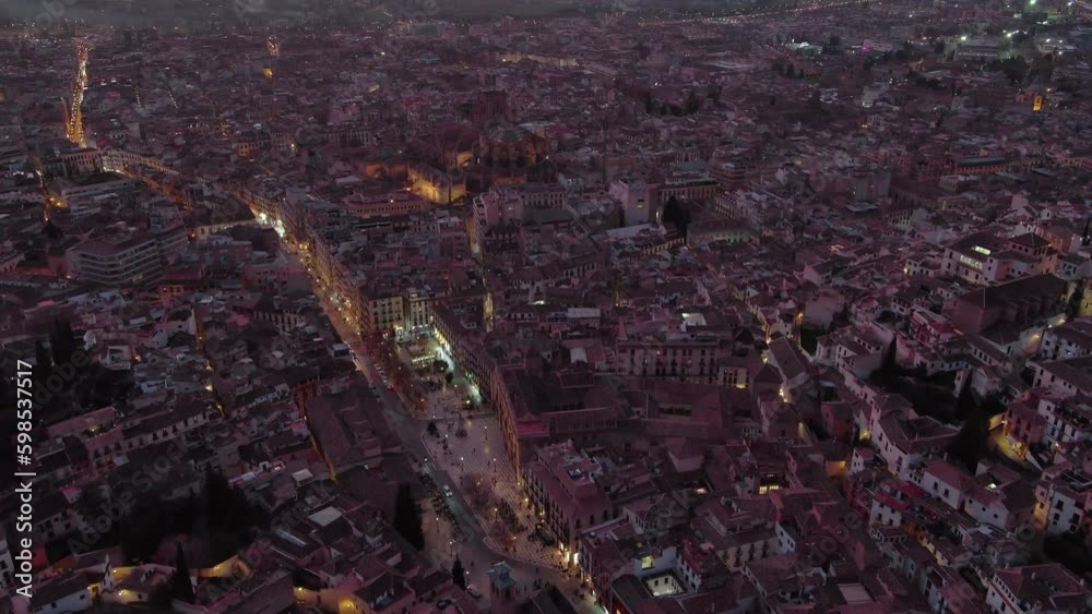 Aerial view of Granada Cathedral at dusk, a Roman Catholic church in the city of Granada, Andalusia, Spain. Baroque architecture Aerial view of Granada Cathedral at dusk, a Roman Catholic church in the city of Granada, Andalusia, Spain. Baroque architecture