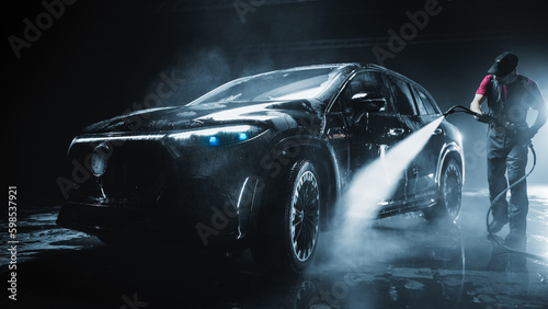 Принти на полотні Brand New Electric Vehicle from a Production Line is Being Cleaned with a Water High Pressure Cleaner