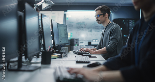 Fotografie Portrait of a Thoughtful Engineer Working on Desktop Computer in a Technological Office Environment