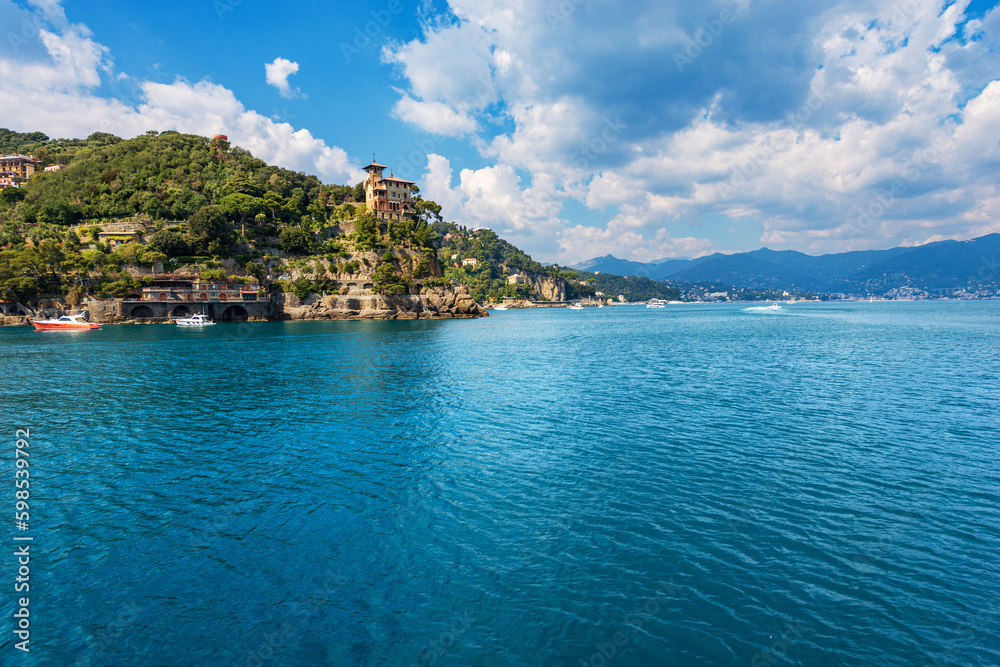 Coast of the famous village of Portofino, luxury tourist resort in Genoa Province, Liguria, Italy, Europe. Holiday villas, Mediterranean sea (Ligurian sea).