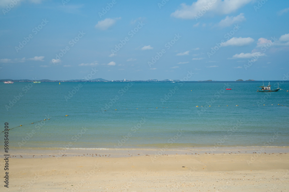 Blue sea water with wooden longtail boat fishing boat on the morning, beautiful sea and island or mountain at Koh Samet Beach in Trat province, Thailand.