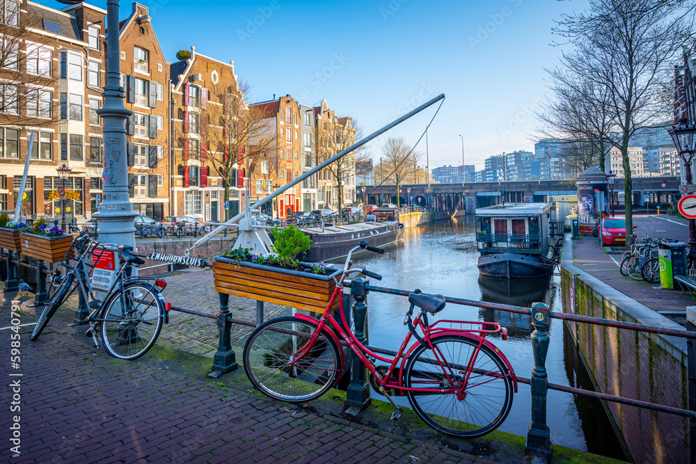 Amsterdam canals with bicycles.