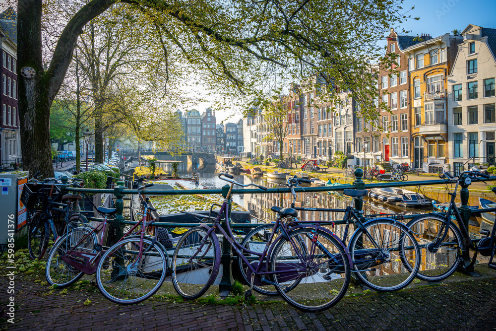 Bicycles in Amsterdam canals. Amsterdam is the capital and most populous city of the Netherlands.