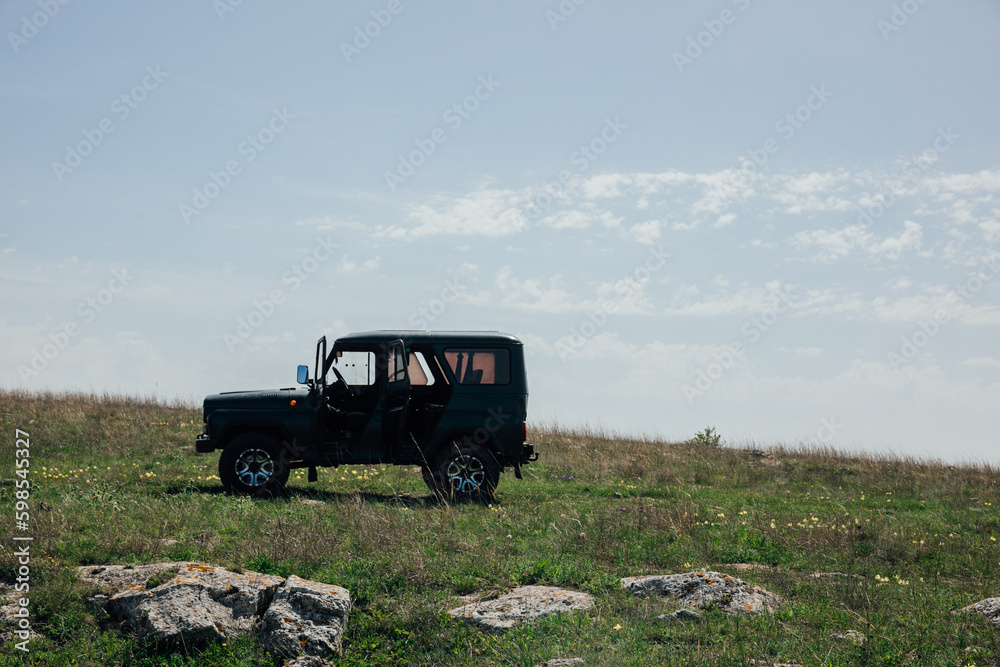 car stands on the mountain nature journey