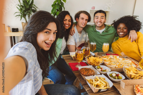 selfie group friends eating and drinking - pizza  burgers  beer. - focus on Hispanic women -