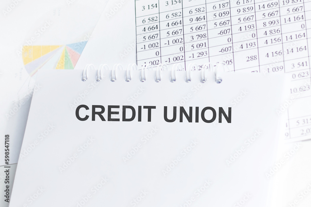 Credit Union. text on craft paper. notepad on notepad Credit Union. text on craft paper. notepad on notepad